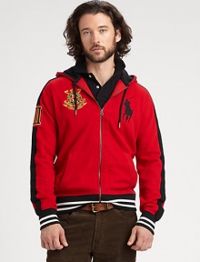 Accented with bold athletic stripes, a full-zip fleece hoodie celebrating the St. Moritz Polo World Cup on Snow features a snow polo crest and Ralph Lauren's embroidered Big Pony for a signature finish.Zip-up styleAttached drawstring hoodWaist slash pocketsBanded cuffs and hem85% cotton/15% acrylicMachine washImported Accented with bold athletic stripes, a full-zip fleece hoodie celebrating the St. Moritz Polo World Cup on Snow features a snow polo crest and Ralph Lauren's embroidered Big Pony for a signature finish.Zip-up styleAttached drawstring hoodWaist slash pocketsBanded cuffs and hem85% cotton/15% acrylicMachine washImported