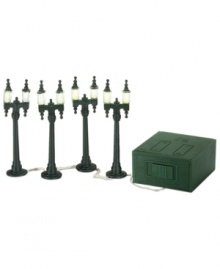 Cast a warm glow on a snow-covered Christmas village with double street lamps from Department 56. A dark green hue and old-world aesthetic add warmth and charm to your collection. Cast a warm glow on a snow-covered Christmas village with double street lamps from Department 56. A dark green hue and old-world aesthetic add warmth and charm to your collection.