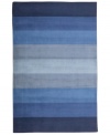 Hand-tufted, blended wool gives an exceptionally soft feel to this rug from the Coastal Treasures collection. In a shimmering, striped design of tonal blues, this sophisticated piece adds serene character to every decor.