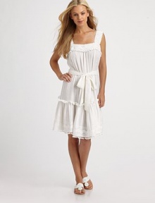 An ultra-feminine coverup with pom pom details and a self-tie waistline for an enviable fit.SleevelessPull-on styleSelf-tie55% linen/45% viscoseDry cleanMade in USA of imported fabric