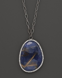 Diamonds circle faceted blue sodalite set in blackened sterling silver. By Di Massima. Diamonds circle faceted blue sodalite set in blackened sterling silver. By Di Massima.