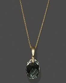 Diamonds accent a faceted green amethyst, set in 14K yellow gold. Diamonds accent a faceted green amethyst, set in 14K yellow gold.