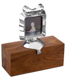 Update a holiday tradition with the modern elegance of Nambe. Part picture frame, part stocking holder, this gift-worthy design shines in luxe metal that's solid enough to support the weight of fine presents. Update a holiday tradition with the modern elegance of Nambe. Part picture frame, part stocking holder, this gift-worthy design shines in luxe metal that's solid enough to support the weight of fine presents.