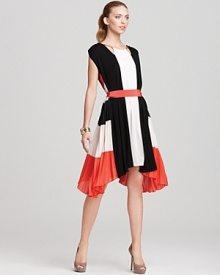 Add maximum impact to your work-to-evening look with the BCBGMAXAZRIA Brit dress. Boasting bold color, an edgy cut-out neckline and side pleating, this sculptural frock will help you reach stylish new heights.