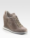 Suede sneakers with a silvertone logo, elevated by a covered wedge. Self-covered wedge, 3½ (90mm)Suede upperLeather liningRubber solePadded insoleImported