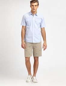 A day at the beach never looked so good; pair this vibrant button-front classic, shaped in lightweight cotton, with cotton shorts for a look that exudes effortless summer style.Button-frontChest flap pocketsCottonMachine washImported