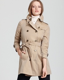 A trench so covetable, you'll find yourself wishing for rainy days--this Burberry Brit rainwear trench keeps the elements at bay and your style in check. A trench so covetable, you'll find yourself wishing for rainy days--this Burberry Brit rainwear trench keeps the elements at bay and your style in check.
