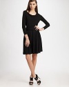 Soft jersey in a slinky cowlneck silhouette, slightly shirred throughout for a flattering fit.CowlneckLong sleevesPullover styleAbout 18 from natural waistViscoseDry cleanImported