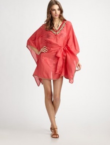 An unmistakable must-have thanks to gorgeous beading and a waist-accentuating self-tie belt, this flattering coverup has it all. Beaded v-neckBraided trimSelf-tie belt on elasticized waist70% cotton/30% silkDry cleanMade in USA of imported fabric An unmistakable must-have thanks to gorgeous beading and a waist-accentuating self-tie belt, this flattering coverup has it all. Beaded v-neckBraided trimSelf-tie belt on elasticized waist70% cotton/30% silkDry cleanMade in USA of imported fabric