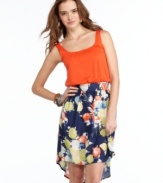 Pump colorful prints into your arsenal of dresses with this style from Living Doll that pairs a solid tank with a vivid, asymmetrical skirt!