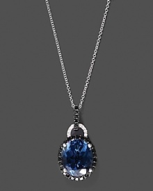 Black and white diamonds frame a faceted London blue topaz, set in 14K white gold.