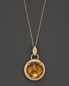 An expertly-rendered, faceted round citrine pendant set in 16 Kt. gold, with fine link chain.