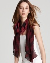 A large check pattern and berry hues make this lightweight scarf a must-have this spring.