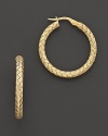 Large woven gold hoop earrings; with signature ruby accent. Post back for pierced ears. Designed by Roberto Coin.