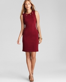 Sleek hardware embellishment infuses the classic Calvin Klein sheath dress with modern edge. Garnish with gold accents and stop traffic from your commute to the corner office.