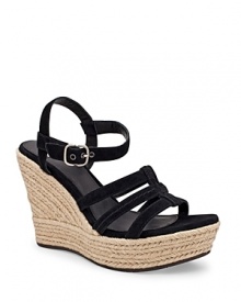 Soft suede is finished with a raffia wedge heel, executed in a classic strappy silhouette. From UGG® Australia.