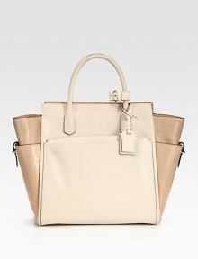An elegant, top-handle tote designed to balance function and luxury with a soft geometry.Double top handles, 4½ dropDetachable adjustable shoulder strap, 21½-23 dropTop zip closureThree outside open pocketsOne detachable zip pouchOne inside zip pocketTwo inside open pocketsLeather lining9½W X 10H X 5DImported An elegant, top-handle tote designed to balance function and luxury with a soft geometry.Double top handles, 4½ dropDetachable adjustable shoulder strap, 21½-23 dropTop zip closureThree outside open pocketsOne detachable zip pouchOne inside zip pocketTwo inside open pocketsLeather lining9½W X 10H X 5DImported