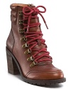 Rugged style takes to the streets with these high heeled hiking boots, featuring a stacked block heel and bright laces. By Lucky Brand.