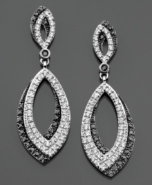 Opulent ovals of round-cut black diamonds (1/3 ct. t.w.) and white diamonds (3/8 ct. t.w.) exude elegance on these sterling silver earrings. Approximate drop: 1-1/2 inches. Opulent ovals of round-cut black diamonds (1/3 ct. t.w.) and white diamonds (3/8 ct. t.w.) exude elegance on these sterling silver earrings. Approximate drop: 1-1/2 inches.