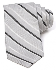 Diagonal stripes dash across a textured silk tie from The Men's Store at Bloomingdale's. Diagonal stripes dash across a textured silk tie from The Men's Store at Bloomingdale's.