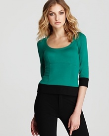 Bring on-trend style to your workday wardrobe with this chic color-blocked Nanette Lepore top.