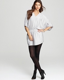 Billowing sleeves and a smocked waistline create a becoming silhouette on this DIANE von FURSTENBERG stretch silk dress, designed in a silvery hue to offset dramatic black accents. Billowing sleeves and a smocked waistline create a becoming silhouette on this DIANE von FURSTENBERG stretch silk dress, designed in a silvery hue to offset dramatic black accents.