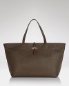 Smartly structured in Italian leather, Salvatore Ferragamo's signature tote is a fast-track to simple sophistication. Carry it for effortless, yet completely elegant style.