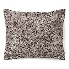 Harkening back to a more primitive time, this tribal tattoo sham livens up any room with a pop of daring print. Harkening back to a more primitive time, this tribal tattoo sham livens up any room with a pop of daring print.