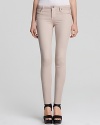 Rock the season's color trend in these spray-on tight Helmut Lang skinnies. So cool they're haute, this saturated silhouette features a logo-embossed button at the front and seam detail at the knees for unique detail.