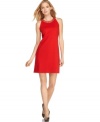 Standout in one of the season's hottest colors with this chic embellished shift dress from MICHAEL Michael Kors!