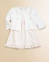 A soft pima cotton knit is lovingly adorned with lace trim, pintucked detailing and delicate rosettes for a sweet ensemble.CrewneckShort puffed sleevesButton frontLace trim around neck and cuffsRuffled hemMatching bloomersPima cottonMachine washImported Please note: Number of buttons/snaps may vary depending on size ordered. 