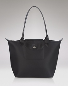 Leather-kissed nylon is at once sporty and luxe, perfect for hauling everything from your gym clothes to the European editions of your favorite fashion magazines. Leather-kissed nylon is at once sporty and luxe, perfect for hauling everything from your gym clothes to the European editions of your favorite fashion magazines.