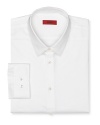 Slim fit, long sleeved button front shirt with point collar. Rounded barrel cuffs. Invisible stitched shorter cuffs. Clean front, no pockets. .
