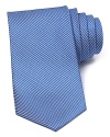 A micro basketweave pattern lends a classic look to this luxe silk tie from The Men's Store at Bloomingdale's.