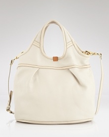 Take your casual look to the next level with UGG® Australia's leather tote. Dual purpose, this versatile, go-anywhere bag can be worn over the shoulder or across the body. Take your casual look to the next level with UGG® Australia's leather tote. Dual purpose, this versatile, go-anywhere bag can be worn over the shoulder or across the body.