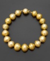 A glamorous touch of sunshine. This 14k gold bracelet features brilliant golden south sea pearls (9-10 mm) and diamond accents. Approximate length: 7-1/2 inches.