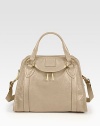 Buttery leather essential with striking goldtone hardware and dual straps, evokes unique downtown style.Double top handles, 4 drop Adjustable shoulder strap, 10-15 drop Top zip closure One outside zip pocket Protective metal feet One inside zip pocket One inside open pocket Fully lined 14W X 10H X 5D Made in Italy