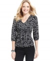 A whimsical graphic print and flattering empire waist makes this petite NY Collection top a brilliant find!