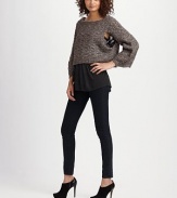 Soft, nubby knit, closely cropped with wide dolman sleeves.Boatneck Ribbed trim Pullover style About 18 from shoulder to hem 50% polyacrylic/40% wool/10% mohair Dry clean Imported