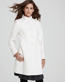 A timeless A-line silhouette garners ladylike charm with a ruffled double collar on this polished DKNY coat.