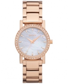 Ready to dazzle? This radiant watch by DKNY is the ticket. Rose-gold ion-plated stainless steel bracelet and round case. Bezel embellished with crystal accents. Mother-of-peal dial features rose-gold tone stick indices, crystal markers, three hands and logo. Quartz movement. Water resistant to 50 meters. Two-year limited warranty.