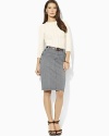 Anchor-embossed buttons and slim stripes add nautical panache to a sleek-fitting skirt silhouette in cotton twill.