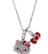 A defining statement, twice over. Hello Kitty's necklace, set in sterling silver, features pave crystals and an extra bow-what the iconic character is most known for. Approximate length: 18 inches. Approximate drop: 1/2 inch.