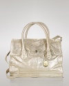 Let Cole Haan's roomy leather shoulder bag lend your look a dose of uptown polish. With a luxe shape and metallic finish, this ladylike style softens a tailored blazer and trousers.