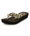 Are you a GUESS Girl? The Scarletta EVA thong sandals blend casual and glam with metallic shine and shimmery sequins.