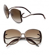 Serpentine detailing adds a creative touch to these stylish metal frames. Available in bronze with gradient brown lens.Metal serpent temple100% UV protectionMade in Italy