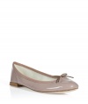 Add effortless elegance to your look with these must-have ballerina flats from perennial favorite shoe brand Repetto - Rounded toe, flat leather sole, front bow detail - Pair with a tie-neck blouse and a full skirt or an elevated jeans-and-tee ensemble