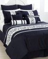 Navy blue, in bloom. Delicate floral embroidery embellishes a sophisticated palette of navy and white for a classic look perfect in any season. Boasting five unique decorative pillows and coordinating coverlet, this set has all the details you need to create a decorator look in minutes. (Clearance)