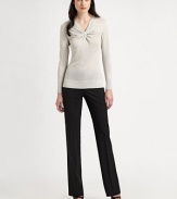 A classic design with a romantic twist: a twisted front detail that won't go unnoticed. V-neckLong sleevesAbout 25 from shoulder to hem60% linen/35% viscose/5% nylonHand washImported of Italian fabric Model shown is 5'11 (180cm) wearing US size Small. 