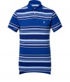 Detailed in ultra soft cotton pique, this striped polo is the epitome of the timeless classic Ralph Lauren look - Small royal collar, button placket, short sleeves, royal trim, embroidered polo player at chest, slit sides, high-low hemline - Classic cut - Wear with everything from jeans and sneakers to colored cords and loafers